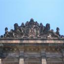The coat of arms between two towers - western facade